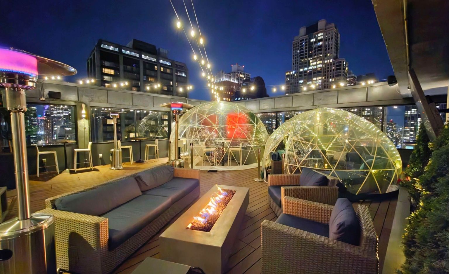 Illuminated SkyDomes overlooking the Chicago skyline at SkyDeck at Twenty Nine